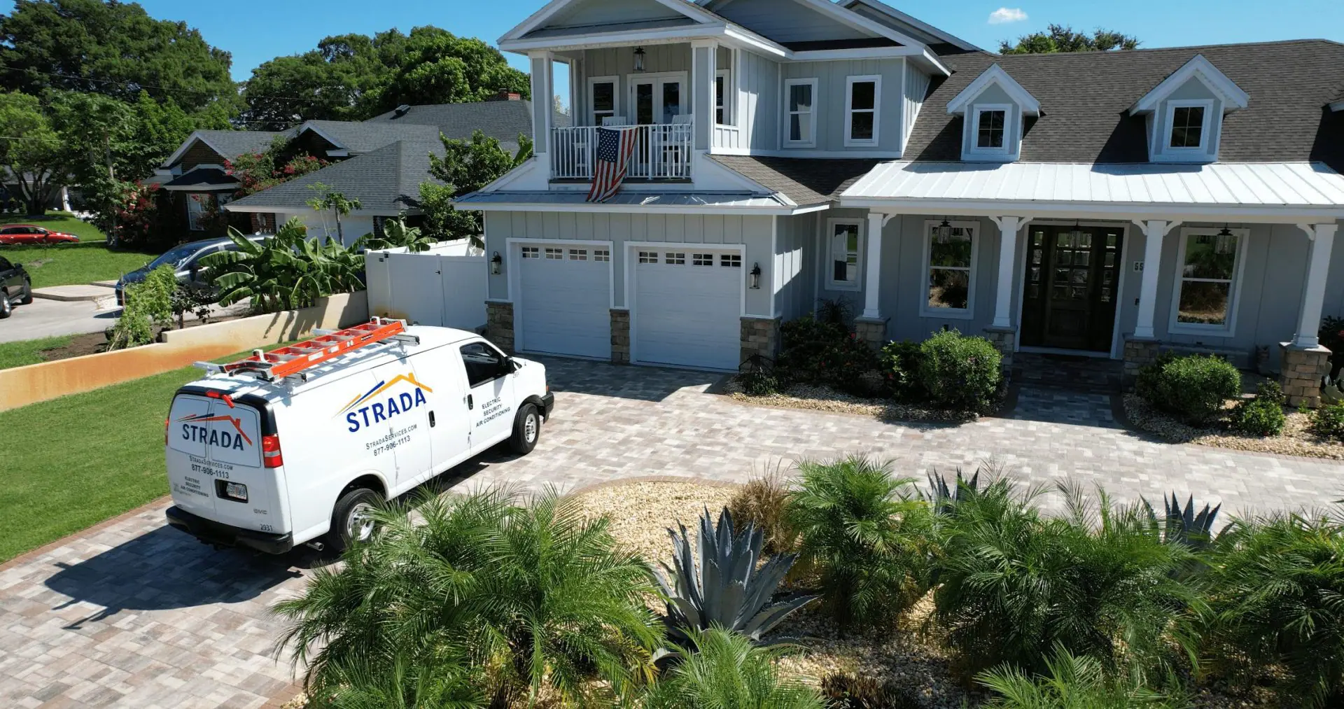 Strada Services truck parked outside residential home