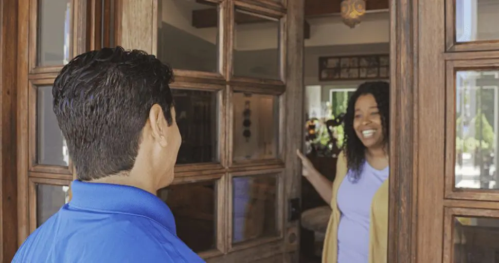 Homeowner welcoming Strada Service Technician