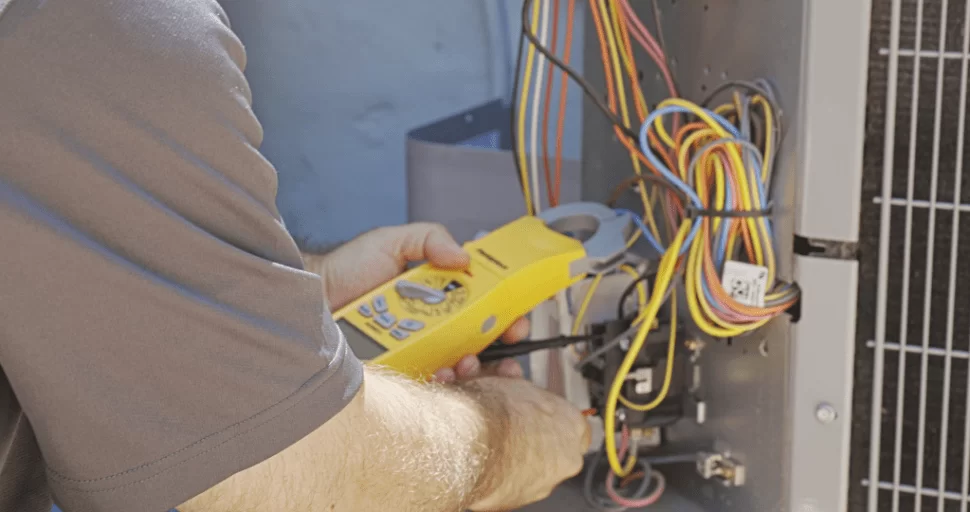 Strada Service Technician working on Commercial HVAC system