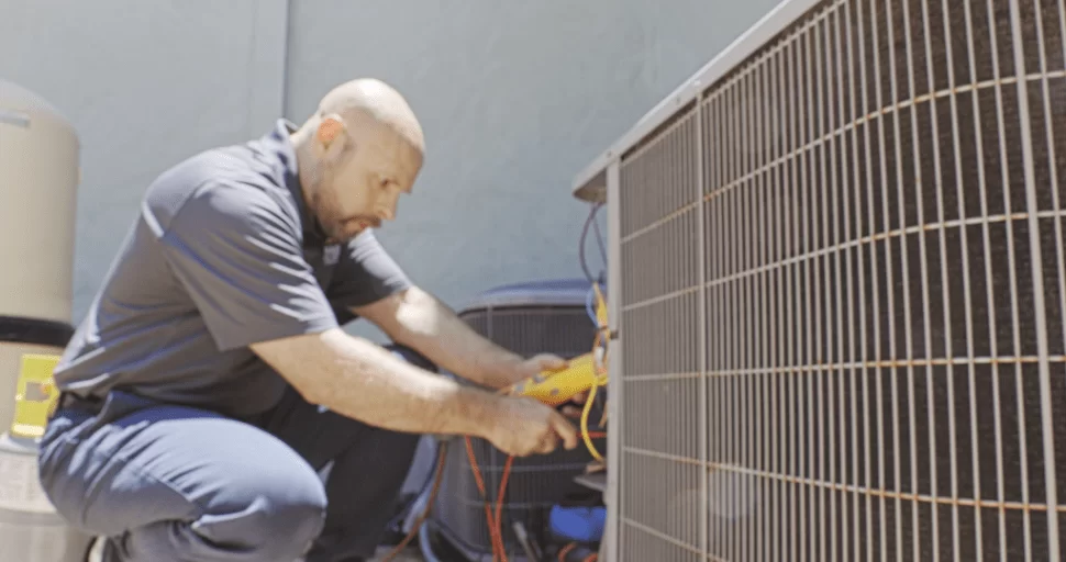 Strada Service Technician working on HVAC system